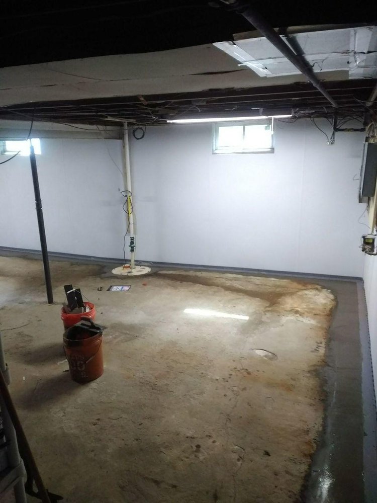 Crawl space encapsulation by Basement Waterproofing Syracuse, 20-mil vapor barrier sealed to the walls