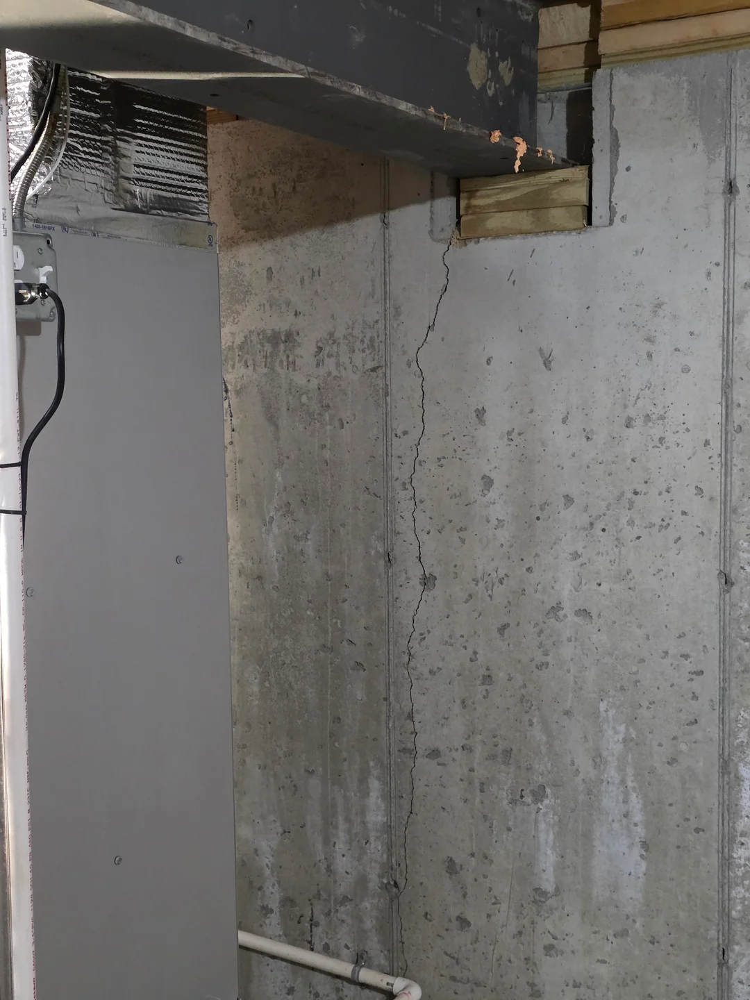 Basement waterproofing Syracuse crew repairing a cracked foundation wall by resin injection
