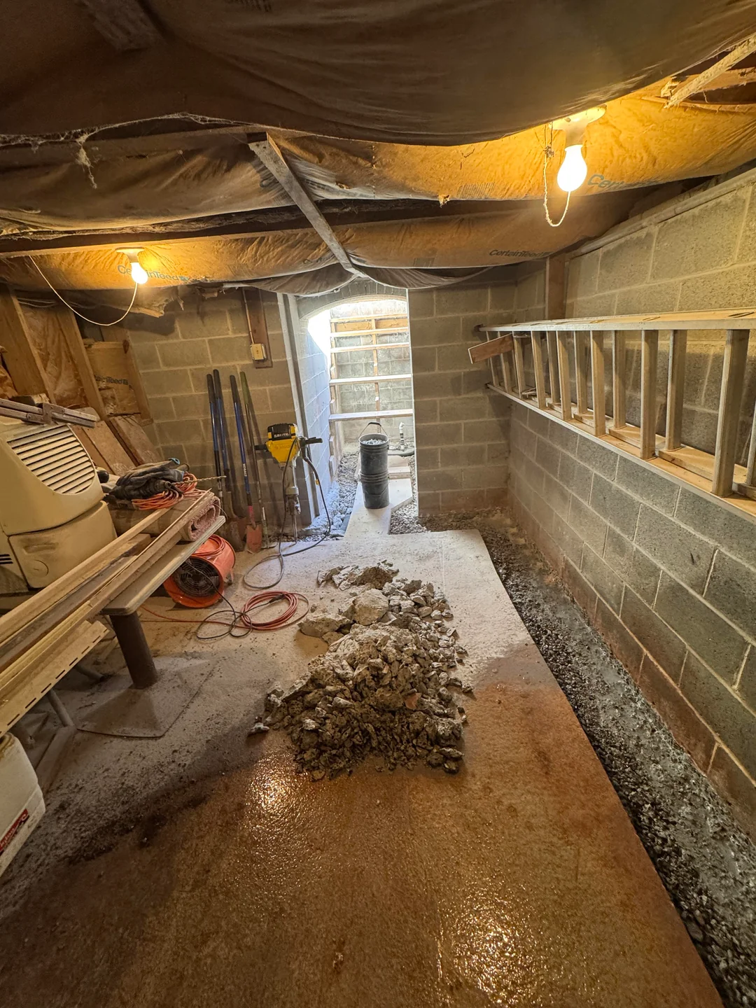 Basement waterproofing contractors in Syracuse, NY on site at a customer home